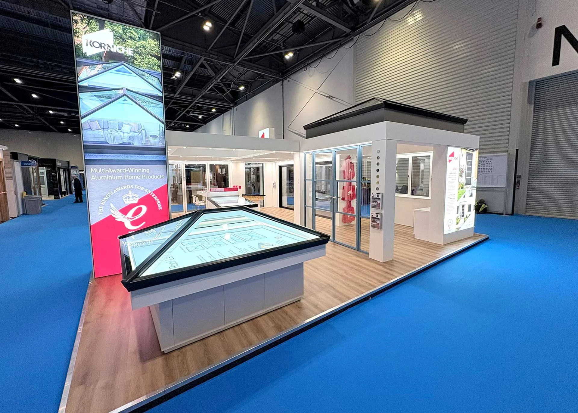 Korniche exhibition stand at the Northern Homebuilding & Renovating Show in Harrogate, displaying aluminium roof lanterns, sliding doors and glazing systems.