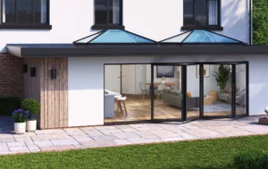 Two elegant Korniche Roof Lanterns flood a modern home extension with natural light.