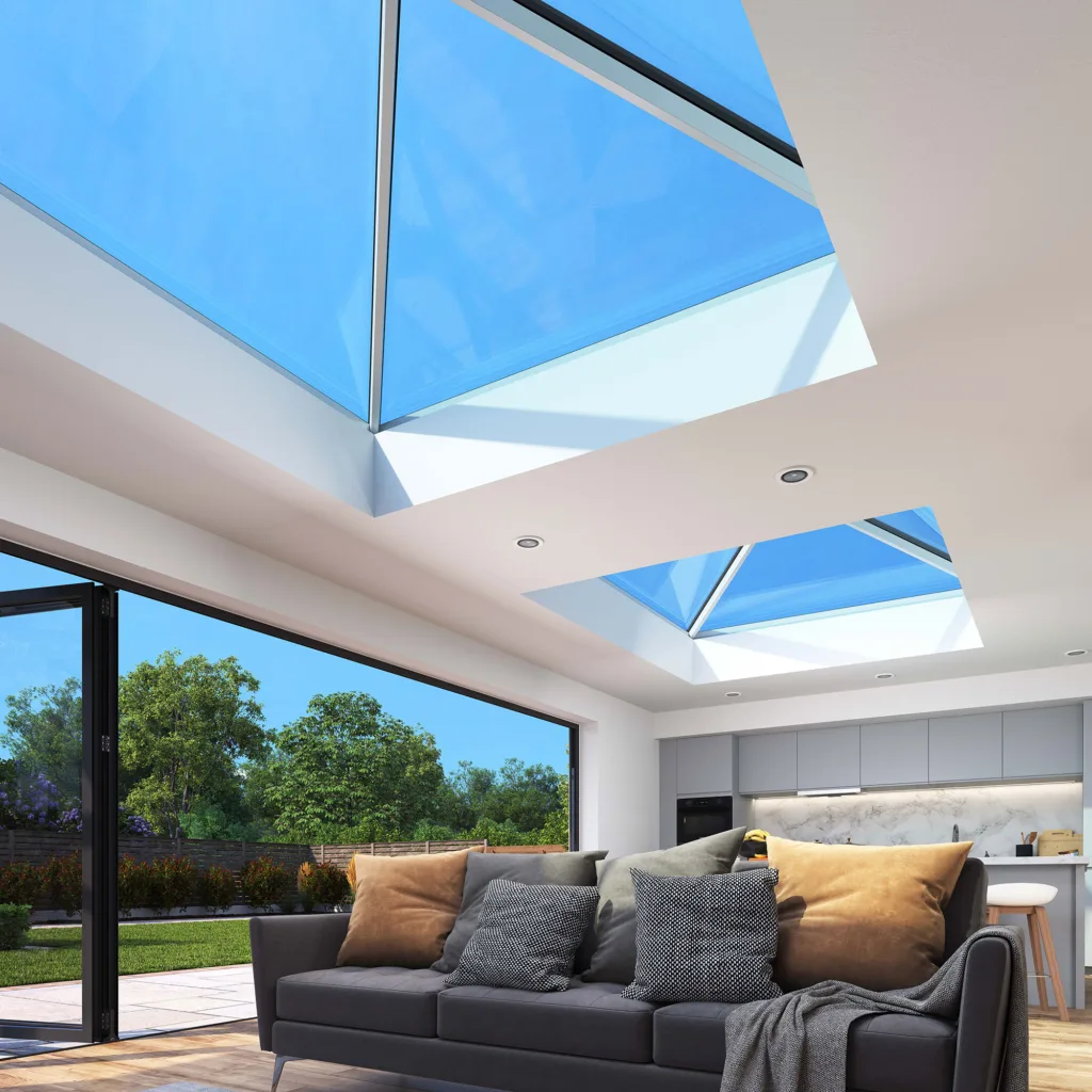 Interior view showcasing two Korniche Roof Lanterns allowing bright blue sky and natural daylight to fill a modern living space.