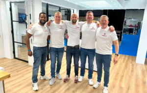 The Korniche team (Kevin Bell, Ashley Parkinson, Chris Wann, Mike Robinson, Ian Bousfield) posing on the exhibition stand.