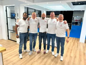 The Korniche team (Kevin Bell, Ashley Parkinson, Chris Wann, Mike Robinson, Ian Bousfield) posing on the exhibition stand.