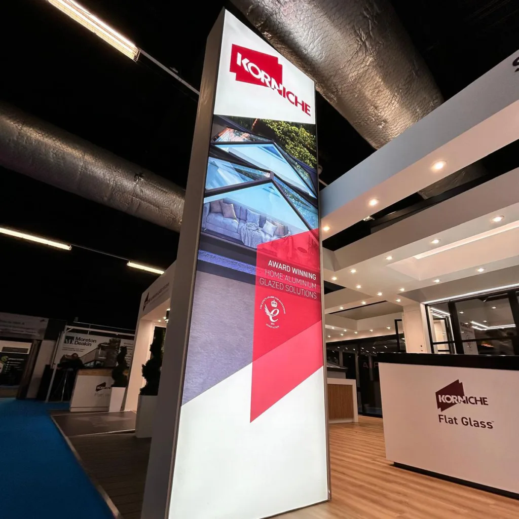 The large Korniche brand sign suspended above the exhibition stand at the Harrogate Homebuilding & Renovating Show.