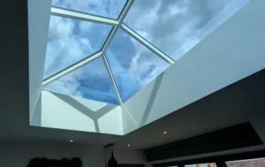 Korniche roof lantern casting geometric light shadows across a white plastered ceiling